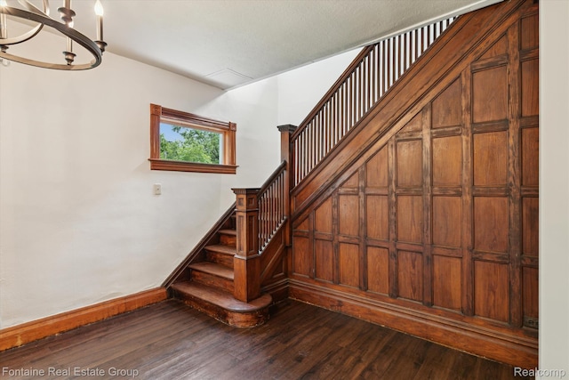 1 Grand Blvd, Battle Creek, MI 49015 - stairway featuring a chandelier and wood finished floors