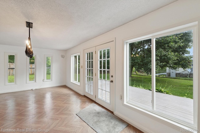 1 Grand Blvd, Battle Creek, MI 49015 - doorway featuring a textured ceiling and baseboards