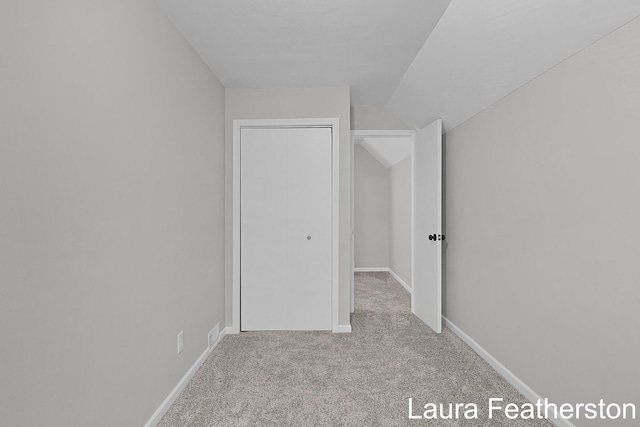 1119 White Ave NW, Grand Rapids, MI 49504 - additional living space featuring carpet flooring and vaulted ceiling