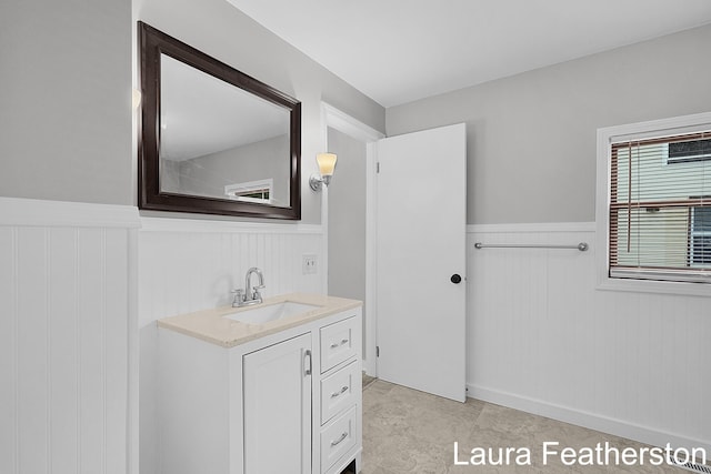 1119 White Ave NW, Grand Rapids, MI 49504 - bathroom featuring a wainscoted wall and vanity