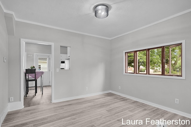 1119 White Ave NW, Grand Rapids, MI 49504 - empty room featuring wood finished floors and crown molding
