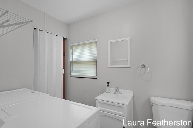 1119 White Ave NW, Grand Rapids, MI 49504 - bathroom with washer / dryer and vanity