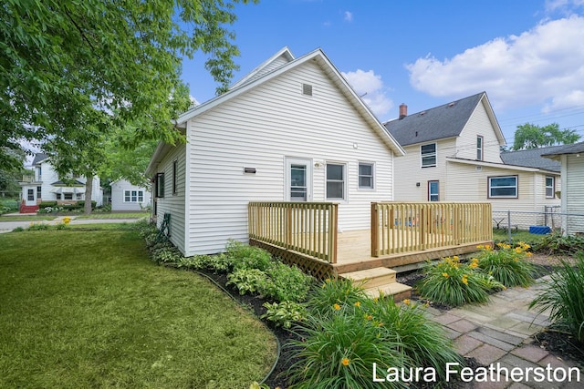 1119 White Ave NW, Grand Rapids, MI 49504 - rear view of property featuring a deck