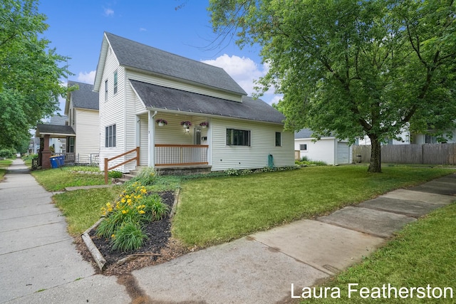 1119 White Ave NW, Grand Rapids, MI 49504 - view of front facade with a shingled roof and a porch