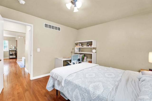 2220 Orchard Crest St, Shelby Twp, MI 48317 - bedroom with wood finished floors and baseboards