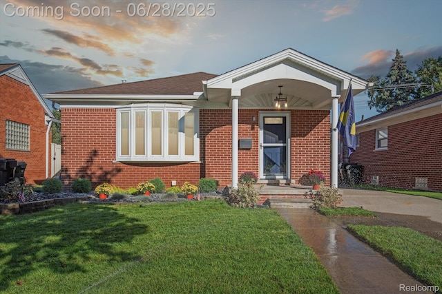 10019 Reeck Rd, Allen Park, MI 48101 - view of front of home featuring brick siding and a lawn