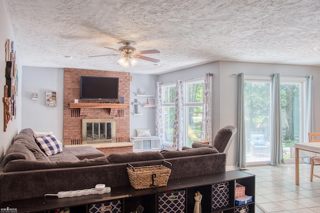 279 Ardelean Dr, Owosso, MI 48867 - living area with healthy amount of natural light, a ceiling fan, tile patterned floors, a textured ceiling, and a fireplace