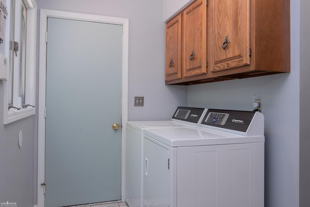 279 Ardelean Dr, Owosso, MI 48867 - laundry room with cabinet space and washer and clothes dryer