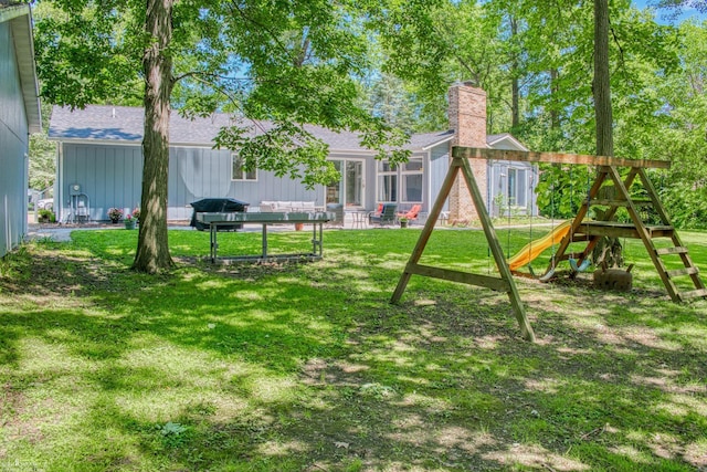 279 Ardelean Dr, Owosso, MI 48867 - view of grassy yard with a playground