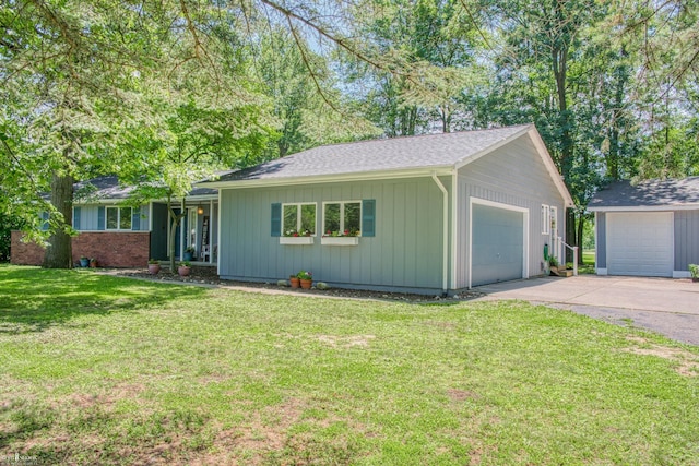279 Ardelean Dr, Owosso, MI 48867 - ranch-style house with a front yard, driveway, and a shingled roof