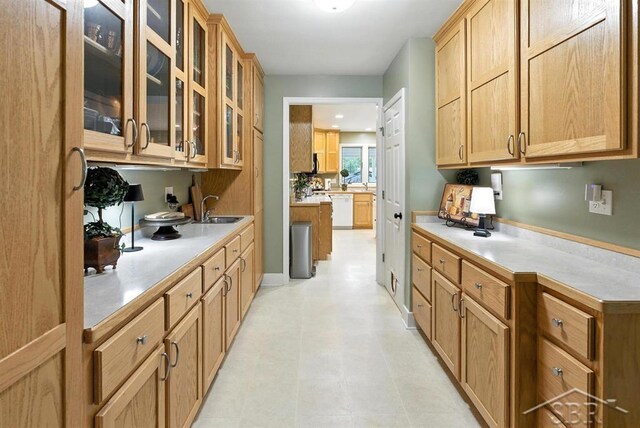 2816 Chippewa Ln, Midland, MI 48640 - kitchen with dishwasher, glass insert cabinets, and light countertops