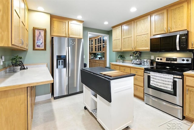 2816 Chippewa Ln, Midland, MI 48640 - kitchen featuring stainless steel appliances, recessed lighting, light countertops, a kitchen island, and light brown cabinets
