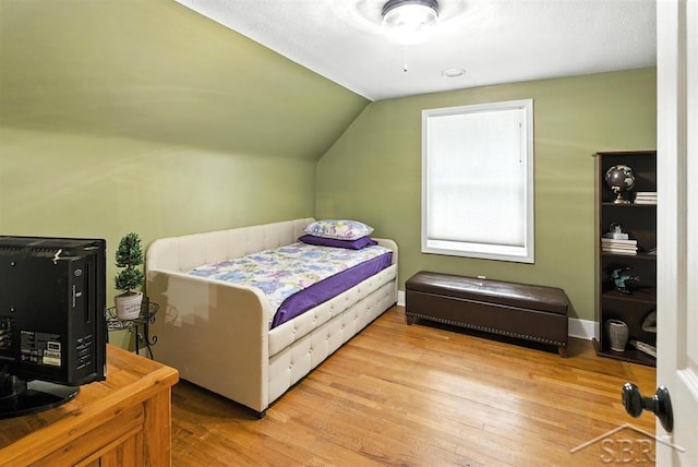 2816 Chippewa Ln, Midland, MI 48640 - bedroom featuring wood finished floors and vaulted ceiling