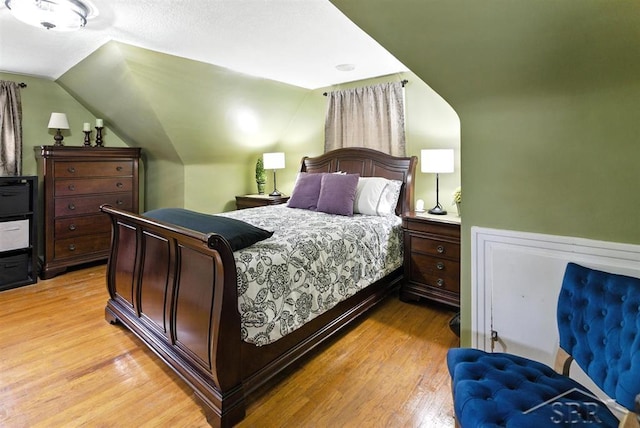 2816 Chippewa Ln, Midland, MI 48640 - bedroom with light wood-type flooring and vaulted ceiling