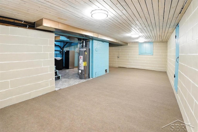 2816 Chippewa Ln, Midland, MI 48640 - finished basement with gas water heater, concrete block wall, carpet floors, and freestanding refrigerator