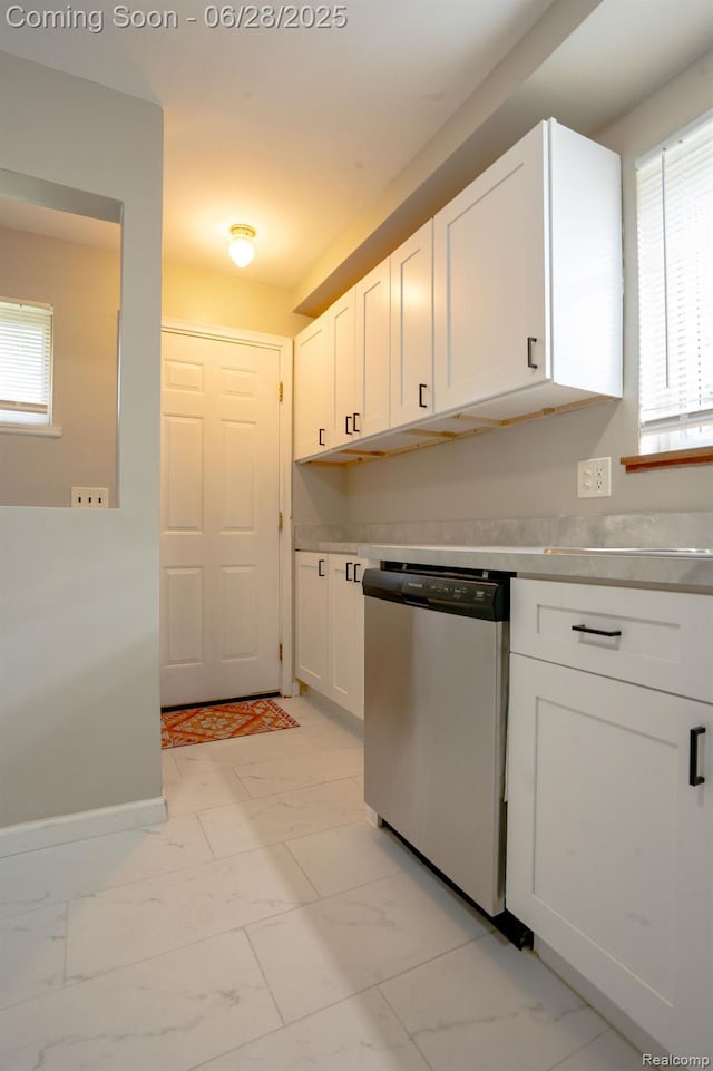 23320 Beechwood Ave, Eastpointe, MI 48021 - kitchen with dishwasher, light marble finish flooring, white cabinetry, light countertops, and plenty of natural light