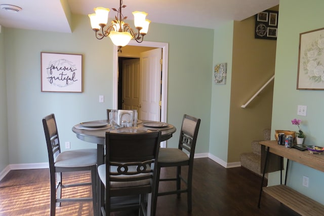 3577 Greenly Ct, Holland, MI 49424 - dining room with a chandelier, stairway, and dark wood-style floors
