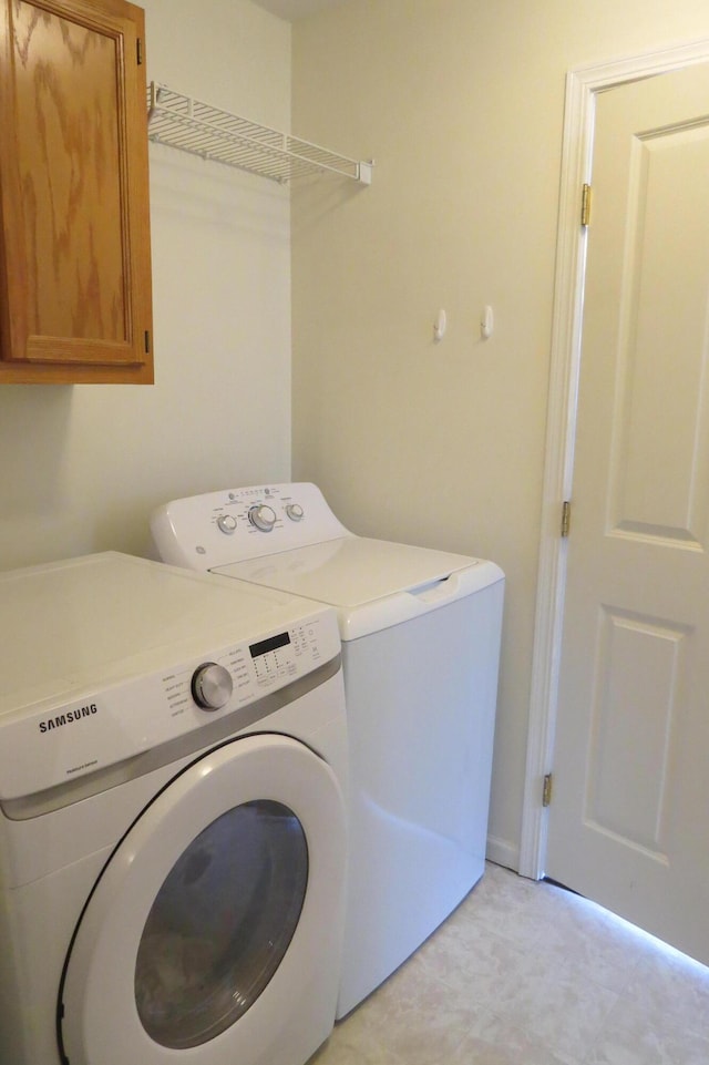 3577 Greenly Ct, Holland, MI 49424 - laundry area featuring independent washer and dryer and cabinet space