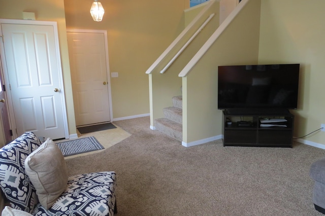 3577 Greenly Ct, Holland, MI 49424 - carpeted living area with stairs and baseboards