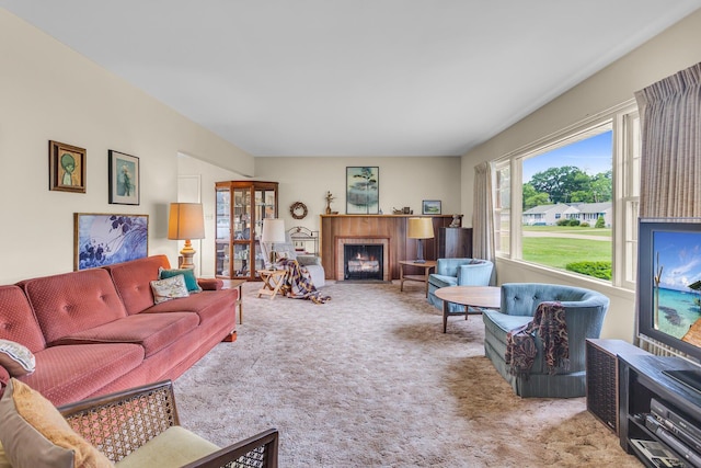 1515 Kensington Dr, Jackson, MI 49203 - living room with carpet and a fireplace with flush hearth