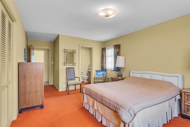 1515 Kensington Dr, Jackson, MI 49203 - carpeted bedroom with baseboards and ensuite bath