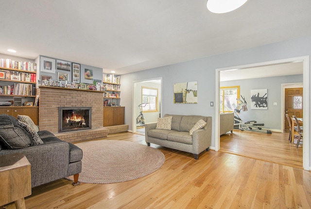 415 Pinewood St, Ann Arbor, MI 48103 - living area featuring plenty of natural light, a fireplace, and light wood-type flooring