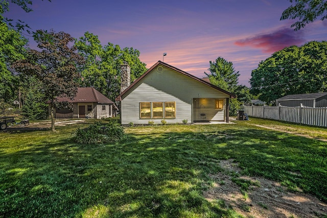863 E Wilcox Ave, White Cloud, MI 49349 - back of property with a chimney