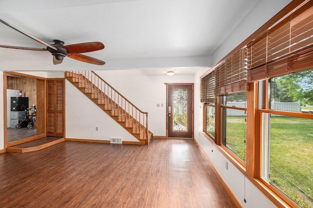 863 E Wilcox Ave, White Cloud, MI 49349 - entryway featuring stairs, wood finished floors, and a ceiling fan