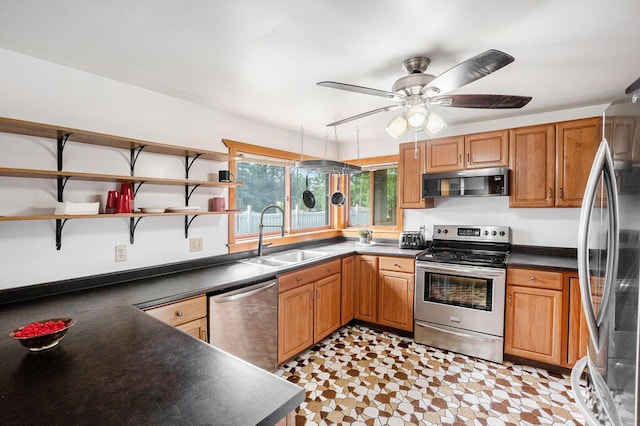 863 E Wilcox Ave, White Cloud, MI 49349 - kitchen with appliances with stainless steel finishes, dark countertops, open shelves, ceiling fan, and brown cabinets