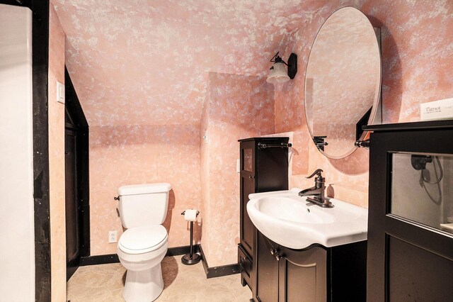 863 E Wilcox Ave, White Cloud, MI 49349 - bathroom with vanity and tile patterned floors