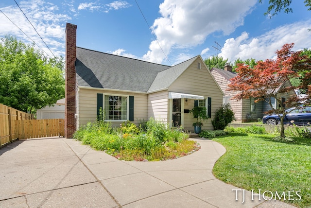 1545 Fuller Ave NE, Grand Rapids, MI 49505 - view of front of house with a chimney and a shingled roof