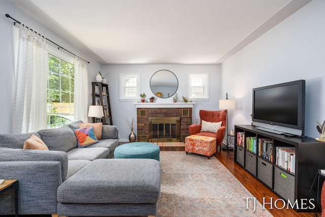 1545 Fuller Ave NE, Grand Rapids, MI 49505 - living area featuring wood finished floors, plenty of natural light, and a fireplace