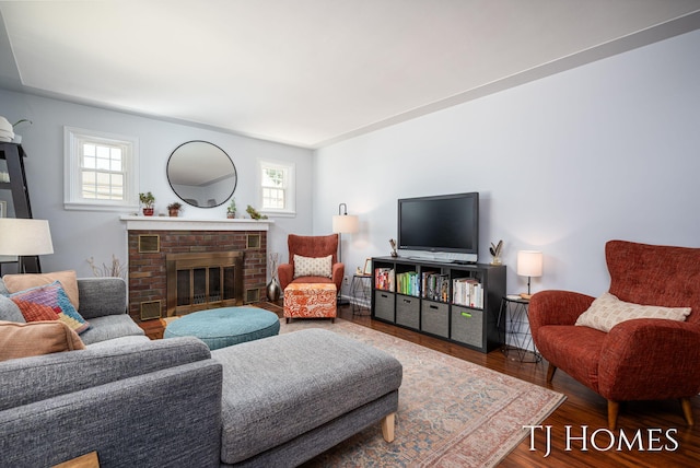1545 Fuller Ave NE, Grand Rapids, MI 49505 - living area featuring healthy amount of natural light, wood finished floors, and a fireplace