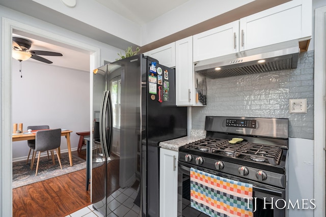 1545 Fuller Ave NE, Grand Rapids, MI 49505 - kitchen featuring stainless steel range with gas stovetop, under cabinet range hood, white cabinets, and backsplash