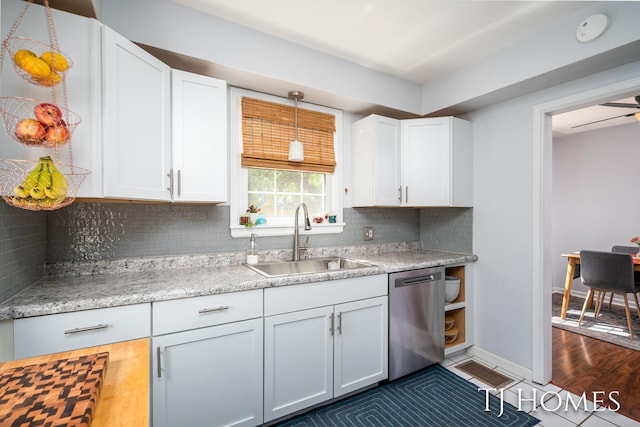 1545 Fuller Ave NE, Grand Rapids, MI 49505 - kitchen featuring dishwasher, white cabinets, decorative backsplash, and decorative light fixtures