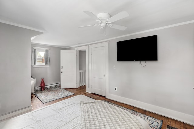 313 Moross Rd, Grosse Pointe Farms, MI 48236 - below grade area with baseboard heating, ornamental molding, wood finished floors, and a ceiling fan