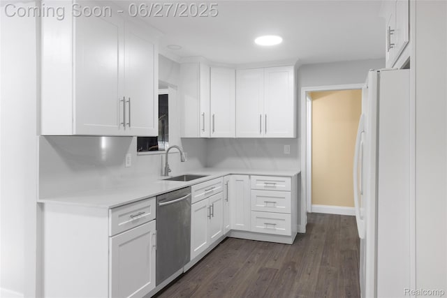 29405 Van Laan Dr, Warren, MI 48092 - kitchen featuring dishwasher, freestanding refrigerator, white cabinets, dark wood finished floors, and light countertops