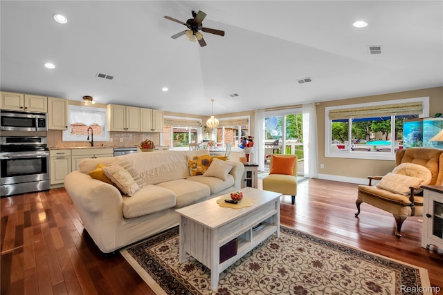 8320 Lagoon St, Commerce Twp, MI 48382 - living area with lofted ceiling, hardwood / wood-style flooring, ceiling fan, recessed lighting, and a chandelier