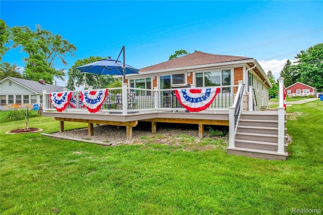 8320 Lagoon St, Commerce Twp, MI 48382 - rear view of house with a deck, a lawn, and a shingled roof
