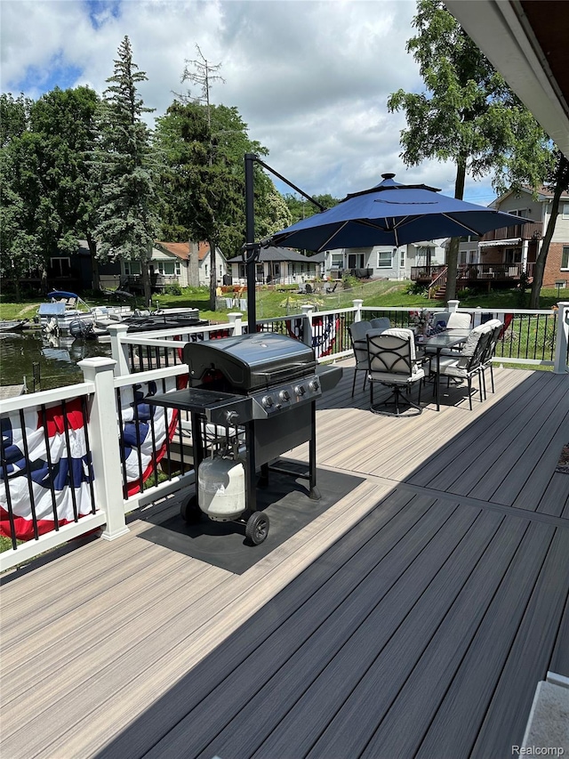 8320 Lagoon St, Commerce Twp, MI 48382 - wooden terrace featuring area for grilling and outdoor dining space