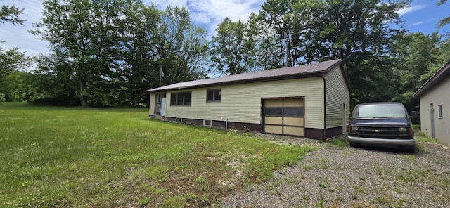 30127 Wells St, Dowagiac, MI 49047 - view of property exterior with a lawn, a metal roof, and an outbuilding