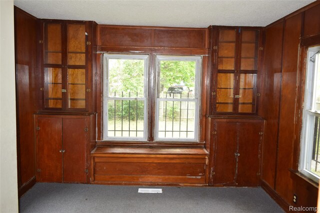 316 W Rankin St, Flint, MI 48505 - carpeted spare room with wooden walls