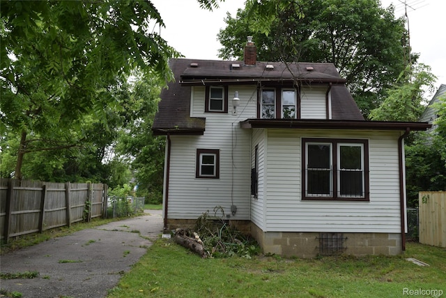 316 W Rankin St, Flint, MI 48505 - back of property featuring asphalt driveway and a chimney