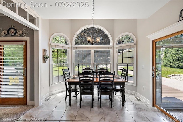 11655 Mcclumpha Rd, Plymouth, MI 48170 - dining room with healthy amount of natural light, a chandelier, and tile patterned flooring
