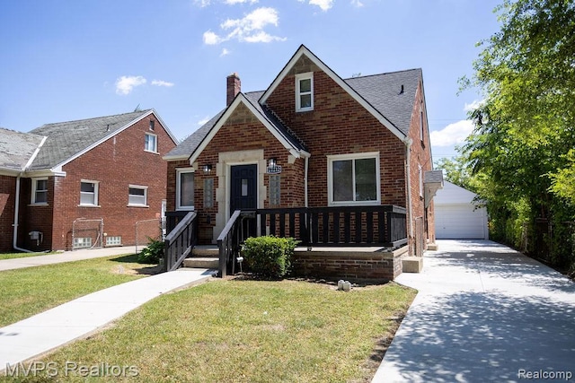 21212 Universal Ave, Eastpointe, MI 48021 - view of front of home with a chimney, brick siding, a front yard, and an outbuilding
