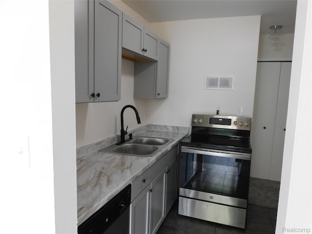 30268 Southfield Rd Unit 229, Southfield, MI 48076 - kitchen with electric stove, dishwasher, dark tile patterned floors, and light stone countertops