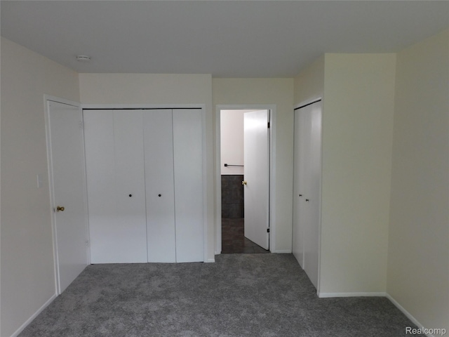 30268 Southfield Rd Unit 229, Southfield, MI 48076 - unfurnished bedroom with carpet floors and multiple closets