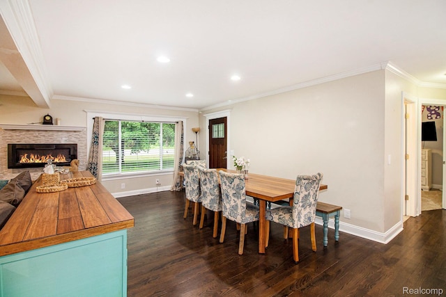 8406 W Ellis Rd, Davisburg, MI 48350 - dining room featuring dark wood-style flooring, crown molding, recessed lighting, and a glass covered fireplace
