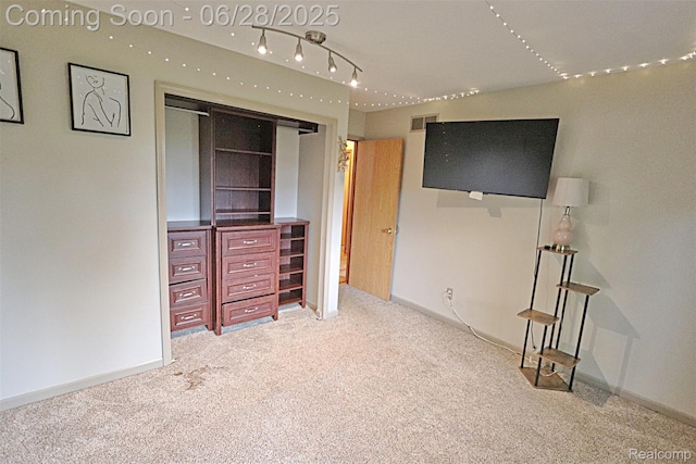 1640 High Pointe Dr, Commerce Twp, MI 48390 - unfurnished bedroom with carpet floors and rail lighting