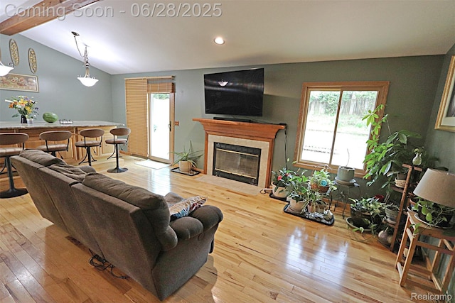 1640 High Pointe Dr, Commerce Twp, MI 48390 - living room with hardwood / wood-style flooring, healthy amount of natural light, a premium fireplace, and recessed lighting